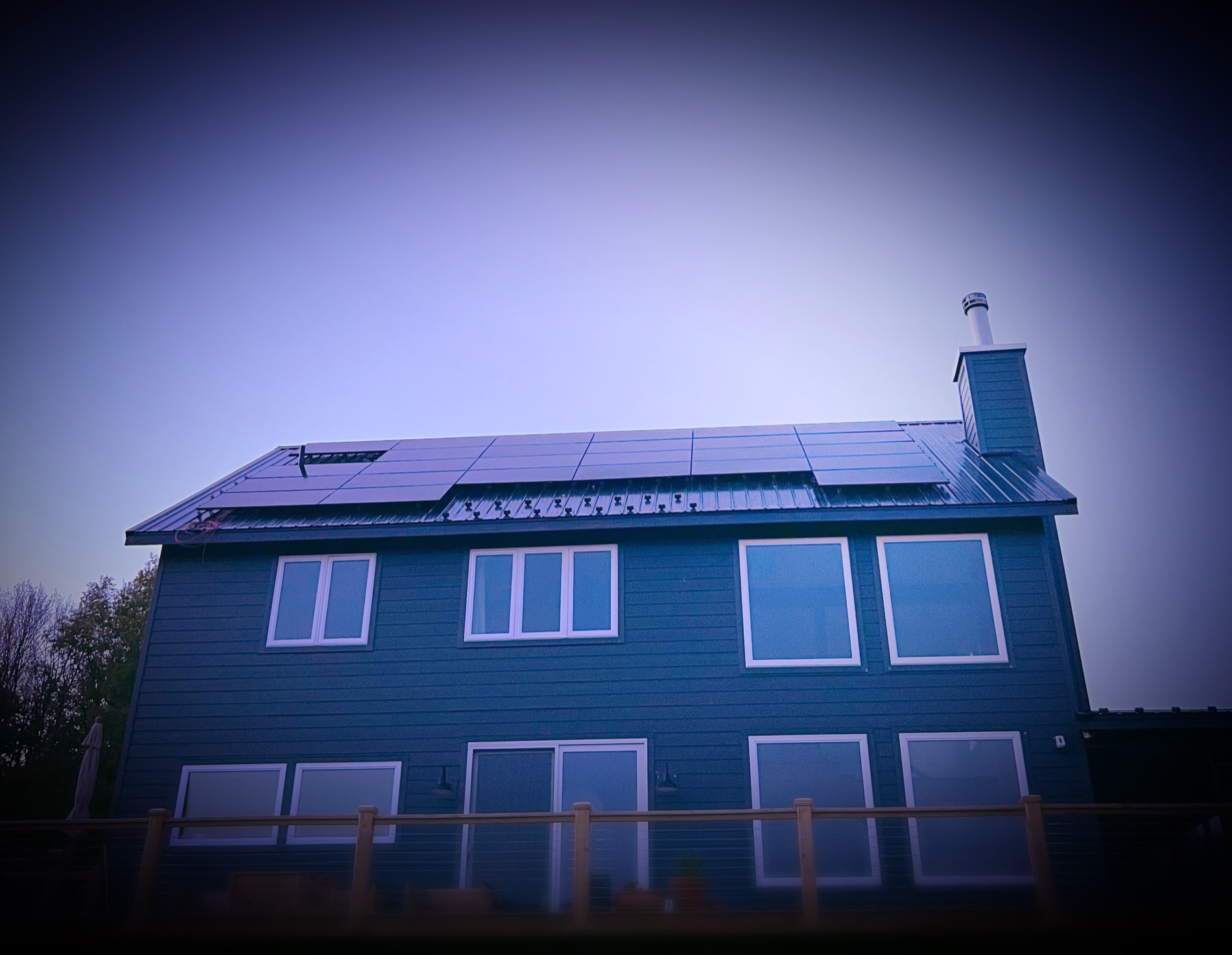 A home with rooftop solar at dusk, financed through Solar Bear Energy