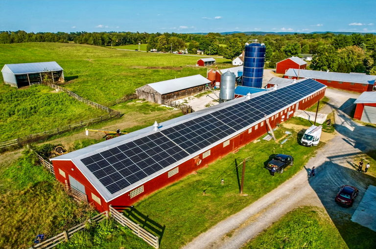 Aerial of a rooftop solar array on a working farm